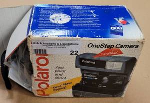 lot 22 image: POLAROID 600 ONESTEP INSTANT CAMERA IN ORIGINAL BOX WITH MANUAL AS SHOWN. SEARCH IT UP