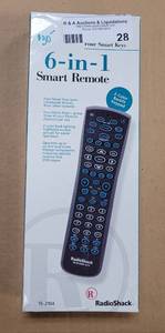 lot 28 image: RADIO SHACK 6-IN-1 SMART REMOTE CONTROL IN BOX AS SHOWN.