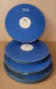 lot 41 image: VINTAGE ROUND MOVIE REEL CASES WITH FILM STRIP AS SHOWN.