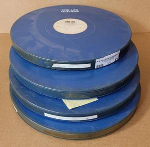 lot 42 image: VINTAGE ROUND MOVIE REEL CASES WITH FILM STRIP AS SHOWN.