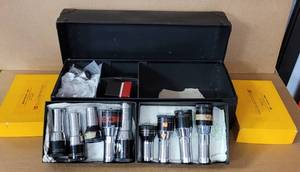 lot 48 image: VINTAGE PROJECTOR LENSES IN ASSORTED SIZESSTYLESBRANDS IN BOX AS SHOWN.