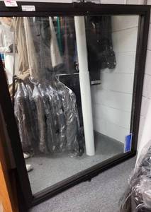 lot 67 image: LARGE COMMERCIAL TYPE METAL FRAMED MIRROR AS SHOWN.