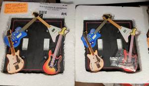 lot 85 image: DOUBLE LIGHT SWITCH COVERS WITH GUITARS AS SHOWN.