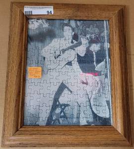 lot 94 image: FRAMED ELVIS PRESLEY PUZZLE AS SHOWN.