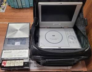 lot 138 image: US LOGIC PORTABLE 7 DVD PLAYER AND VISION CASSETTE TAPE RECORDER MODEL CT-500 AS SHOWN.