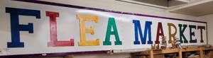 lot 168 image: HUGE FLEA MARKET SIGN WITH MULTICOLORED LETTERING AS SHOWN. THIS ITEM MEASURES APPROX. 22 FT LONG X 37 HIGH X 9 WIDE. BUYER IS RESPONSIBLE FOR PROPER REMOVAL FROM WHERE IT IS LOCATED. MUST SEE