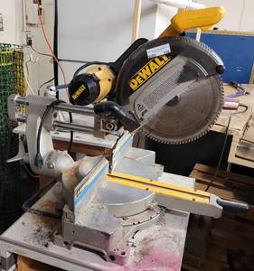 lot 170 image: DEWALT 12 SLIDING COMPOUND MITER SAW MODEL DW708 PLUS TABLESTAND AS SHOWN. TESTED AND WORKS.