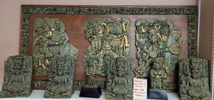 lot 310 image: VINTAGE MID-CENTURY ORIGINAL ZAREBSKI MAYAN WALL ART PLAQUE PLUS 2 PAIRS OF BOOKENDS AND 2 SCULPTURES REPRESENTING THE THREE GODS OF RAIN, WIND, AND BLACK MAGIC AS SHOWN. PLAQUE MEASURES APPROX. 16 X 32. SEARCH IT UP MUST SEE