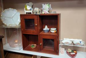 lot 312 image: WOOD DISPLAY SHELFBOX, MILKGLASS VEGETABLE DISHES, PINK PEAR SHAPED GLASS DISH, 1982 AVON HAPPY HOLIDAYS PORCELAIN TRINKET DISH, CROFT CHINA DRESSER TRINKET TRAY (ENGLAND), AND MORE AS SHOWN.