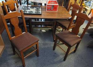 lot 362 image: ALL WOOD DINING TABLE AND 4 CHAIRS WITH CUSHIONED SEATS IN STYLECOLORCONDITION SHOWN.