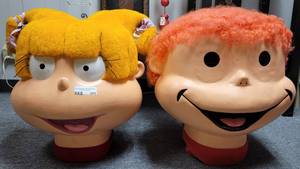 lot 371 image: 2 RUGRATS COSTUME HEADS AS SHOWN.