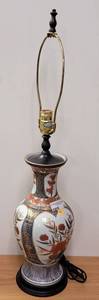 lot 432 image: LARGE VINTAGE LAMP WITH FLORAL DESIGN AND WOODEN BASE IN STYLECOLORCONDITION SHOWN.