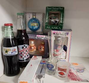 lot 446 image: ASSORTED COLLECTIBLES INCLUDING COKE BOTTLES, ORNAMENTS, VINTAGE BUDWEISER GLASS, SHOT GLASSES, SCALE AND MORE AS SHOWN.
