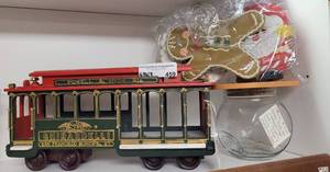 lot 459 image: GHIRRARDELLI COLLECTIBLE TRAIN CAR AND HOLIDAY CANDY JAR WITH VARIOUS LIDS AS SHOWN.