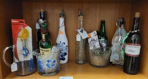lot 501 image: NAUTICAL GLASS PITCHER AND ICE BUCKET, BOTTLE OPENER, BOTTLE DECOR, BOTTLE STOPPERS AND MORE AS SHOWN.