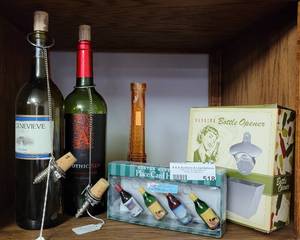 lot 518 image: BOTTLE OPENER IN BOX, PLACE CARDS HOLDER, BOTTLES AND STOPPERS, GLASS EIFFEL TOWER AND MORE AS SHOWN.