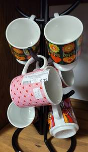 lot 522 image: LOT OF VARIOUS COFFEE CUPS IN STYLES AND DESIGNS SHOWN. RACK IS NOT INCLUDED.