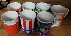 lot 524 image: LOT OF 7 FITZ & FLOYD COFFEE CUPS IN ASSORTED STYLESDESIGNS AS SHOWN.