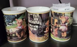 lot 534 image: LOT OF 3 M. I. HUMMEL FINE PORCELAIN COLLECTORS MUGS IN THEMES SHOWN.