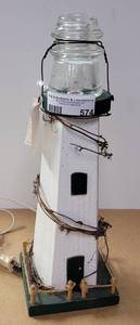 lot 574 image: WOOD LIGHTHOUSE WITH VINTAGE GLASS INSULATOR FOR LIGHT. 16 HIGH.