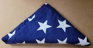 lot 597 image: FOLDED U.S. FLAG AS SHOWN.