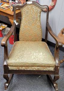 lot 607 image: ANTIQUE WOOD FRAMED ROCKING CHAIR WITH UPHOLSTERED SEAT AND BACKREST IN STYLECONDITION SHOWN.