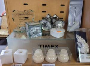 lot 626 image: SILVER PLATE WEDDING THEME PHOTO FRAME, TRINKET BOXES, GLASS HEART SHAPED SCULPTING, MARBLE SQUARED CANDLE HOLDERS AND MORE AS SHOWN.