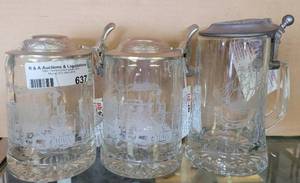 lot 637 image: LOT OF 3 ETCHED GLASS BEER LIDDED STEINS IN STYLEDESIGNS SHOWN.