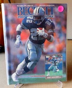 lot 91 image: Vintage Beckett Football Card Monthly #21 December 1991 Emmitt Smith Cowboys Cover VG
