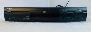 lot 99 image: RCA DVD Player and DVDs