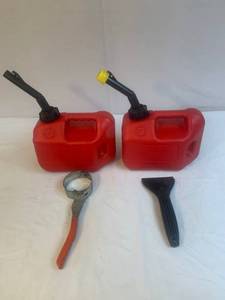 lot 90 image: gas cans, ice scraper, and wrench
