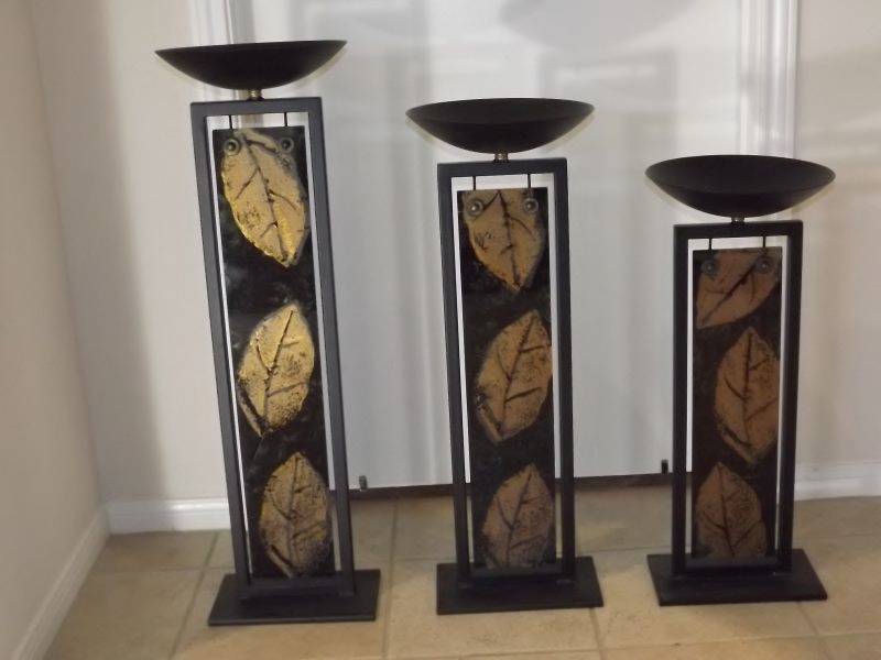 lot 18 image: Decorative floor standing candle stands graduated heights