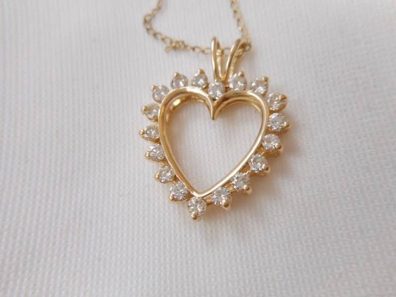 lot 98 image: 14K yellow gold with diamonds heart pendant necklace