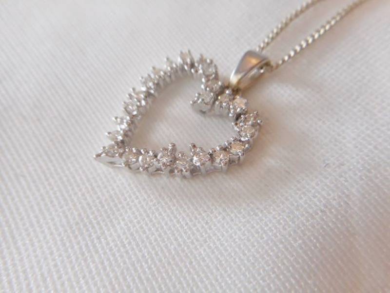 lot 99 image: 14K white gold with diamonds necklace