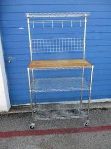 lot 23 image: Metal Bakers Rack With Wooden Cutting Board and Hooks, On Casters