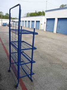 lot 114 image: 4-Shelf-Portable, Folding  Display Stand, And Has 2-Back Casters For EZ Moving