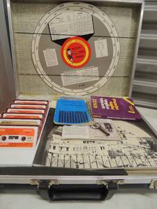 lot 35 image: Berlitz Spanish Learning center 6 single cassette tapes  books and more all in case