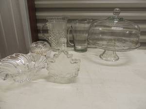 lot 37 image: Leaf design glass canister, glass covered cake stand 2 glass candy dishes and two glass pitchers