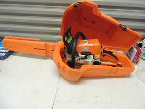 lot 58 image: STHL 021 gas chain saw has extra chain in orange carry case
