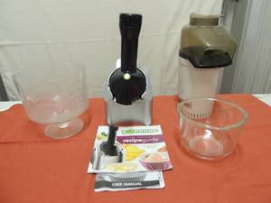 lot 79 image: Glass fruit bowl, Yonanas machine with book for recipes popcorn popper machine with bowl