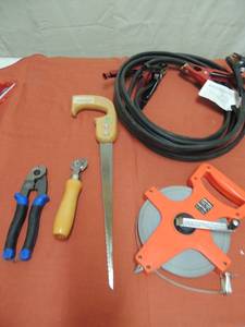 lot 86 image: Lietz Nylon steel tape like new, hand saws, park tool ever hard roller set of jumper cables