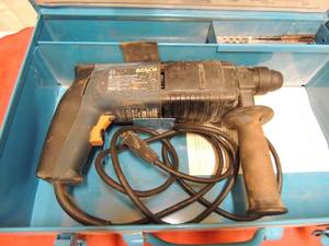 lot 88 image: Bosch rotary drill in original case has some bits included paperwork included