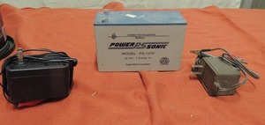 lot 91 image: Power sonic sealed rechargeable battery has plugs and connectors inside coffee cans