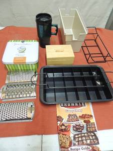 lot 97 image: Gooey chewy brownie pan with built in slicer, Key lime tin, Shredders, cedar box, ice tray