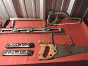 lot 111 image: Several hand saws and 3 different sizes of levels
