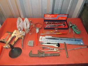 lot 123 image: Metric socket 14 piece new  in case, pipe wrench, staple gun, and staples safety glasses and screw drivers green metal tool box
