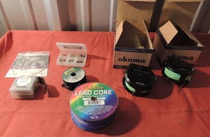 lot 143 image: Fishing lot- 2 Okuma Sierra 55-b fishing line new, Cabalas lead core 18L, Sportsman 6x 30m fishing line Sportsman fly fishing lures 2 NIP trout lines