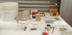 lot 146 image: Misc. lot of screws and nails pegboard, hooks, door pieces and more