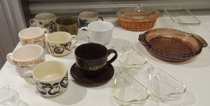 lot 196 image: 3 pear 12 glass dishes various soup cups with recipes on the side onion shaped glass dish glass covered dish in wicker holder 2 Pyrex pie plates and one loaf pan