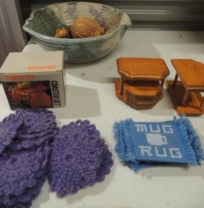 lot 210 image: Hamerstier wooden coasters one used one new in box,  hand made COASTERrugs for glasses blue and purple and large clay bowl